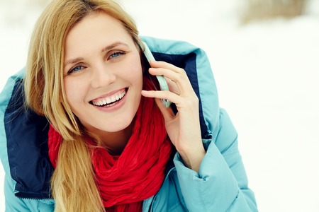 beautiful blonde woman talking on the phone