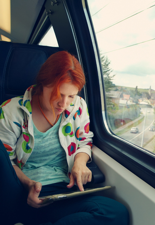 Woman riding on a trainの写真素材