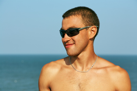 athletic man on the beachの写真素材