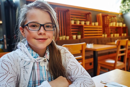 funny little girl with glassesの写真素材