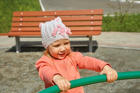 little girl on playgroundの写真素材