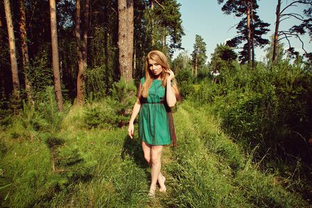 outdoor portrait of a beautiful young blonde womanの写真素材