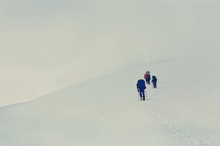 Group of hikers in the mountain. Climb to the top. mountaineeringの写真素材