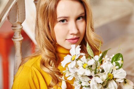 woman with a bouquet of white flowersの写真素材