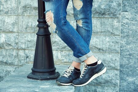 stylish woman near lamp post. legs closeup.の写真素材