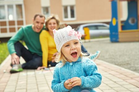 portrait of a little girl with parentsの写真素材