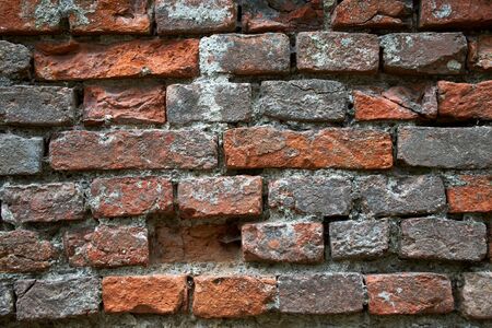 Old cracked brick wall. rough surface texture.の写真素材