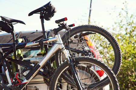 car is transporting bicycles on rack. bikes on the trunk.の写真素材