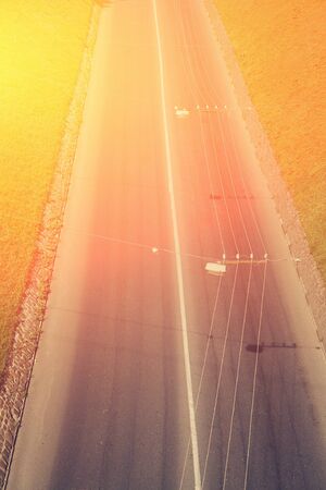 motorway out of city. going cars on the road.の写真素材