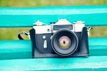 Old retro camera on vintage wooden boards. abstract background.の写真素材