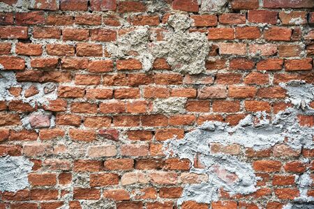 Old cracked brick wall. rough surface texture.の写真素材