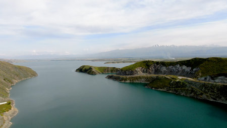 Aerial view of a reservoir with fresh water with the mountains in the backgroundの写真素材