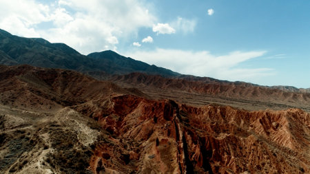 Aerial view of canyon and mountains with rocky landscape and brown soil typeの写真素材