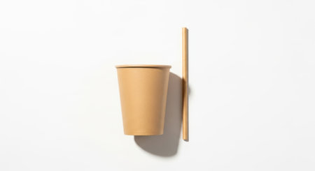 Disposable coffee cup and chopsticks on white background, top viewの素材