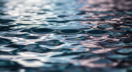 Abstract background of rippled water in a swimming pool. Selective focus.の素材