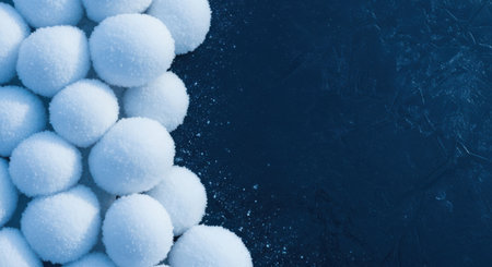 Snowballs on a dark blue background. Top view. Copy space.の素材