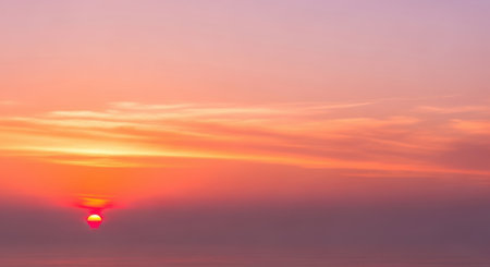 Sunset sky with cloud and sunlight background,sunset sky backgroundの素材