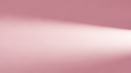 Abstract pink background. Light from the window on a pink background.の素材