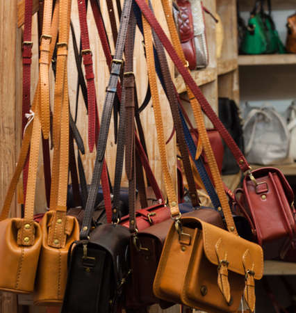 Brown leather backpack hanging on the wall. fashion item sell shopping photoの写真素材