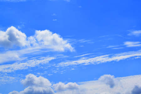 Clouds over blue sky in summer day, backgroundの写真素材
