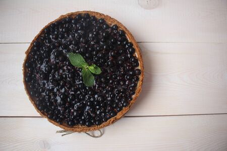 whole cheesecake with blackcurrant and mint. view from aboveの写真素材