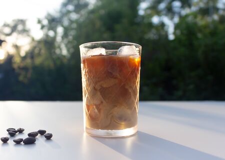 Cold coffee with milk in a glass glass on the nature.の写真素材