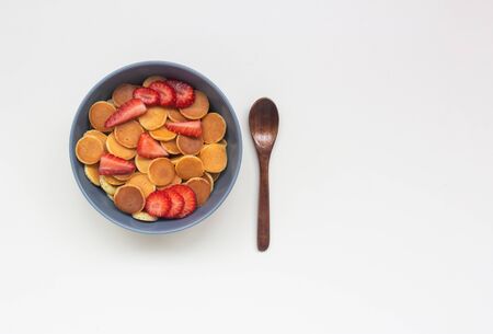 Little pancakes with strawberries in a gray bowl.の写真素材