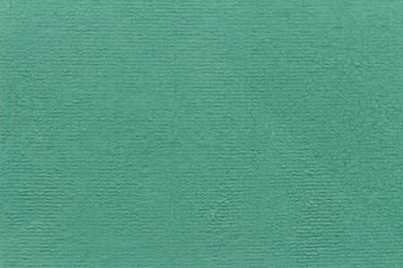 Light green textured background with cracks. Blossomed in the sun. Copy space.の写真素材