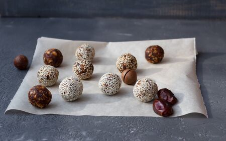 Energy balls on parchment paper with macadamia nut and dates.の写真素材