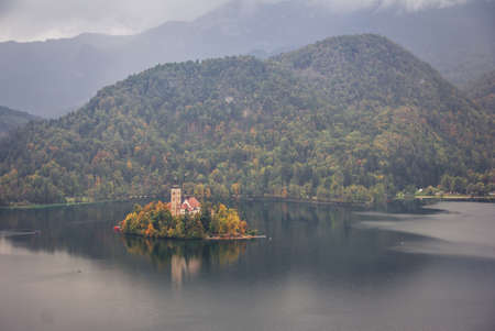 Lake Bled and island church on a rainy dayのeditorial素材