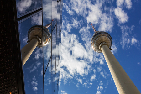 Slender Television Tower of Berlin soaring skywards in Alexanderplatz in a cloudy dayのeditorial素材