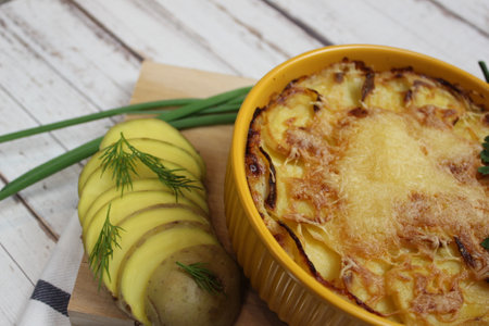 potato gratin, potato casserole with cream, gratin dauphinois, french cuisine, Potato gratin, backed potato slices with creamy sauce. top view.の写真素材