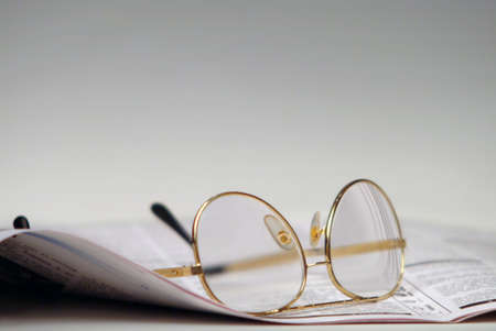 Newspaper and glassesの写真素材