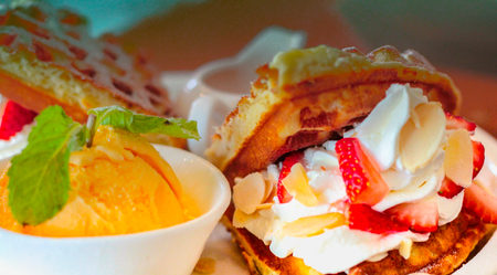 bakery afternoon snack yellow ice cream and white cream candyの写真素材