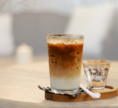 Ice coffee drink style on wood plateの写真素材