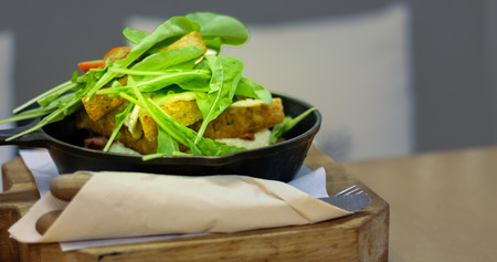 Vegetable Salad dress and bread on wood plateの写真素材