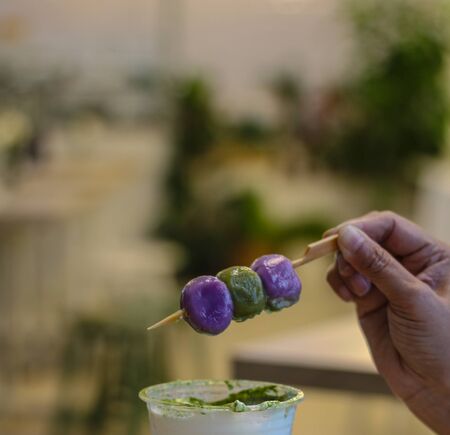 Dessert ball made from flour Mixing natural food colors with skewers blurred background
