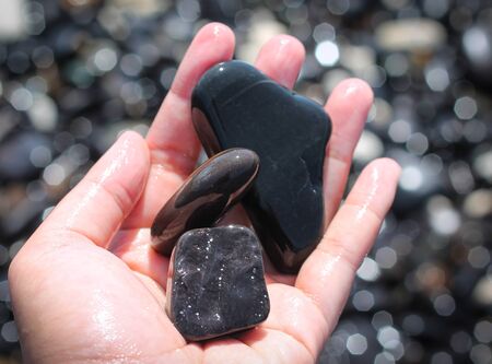 Beautiful boulders along the beach have rounded edges. Black Onyx follows the geological search on...