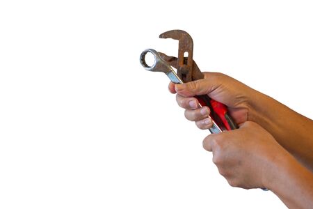 In the hands of the inspector and repair the engine, holding the wrench, the ring, the deck, tighten and release the nut and pipe clamps, Isolated white background with copy space.の写真素材