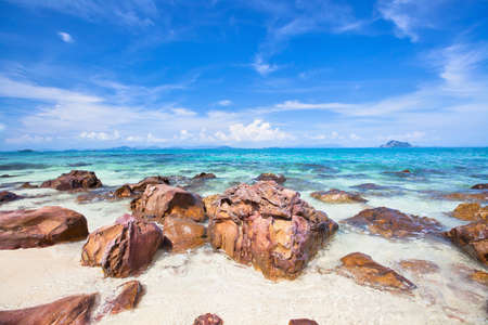 Sea coast with stones and blue skyの写真素材