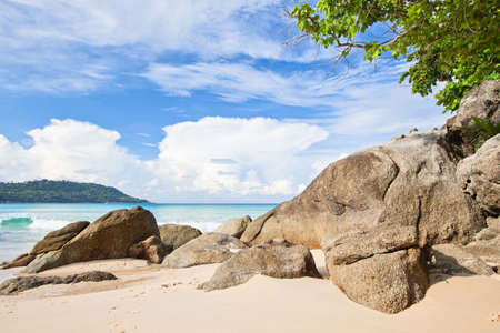 Sea coast with stones and blue skyの写真素材
