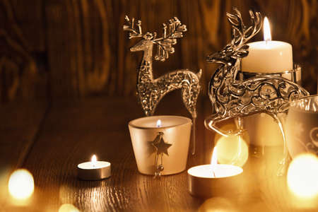 Christmas decoration with candles and deerの写真素材