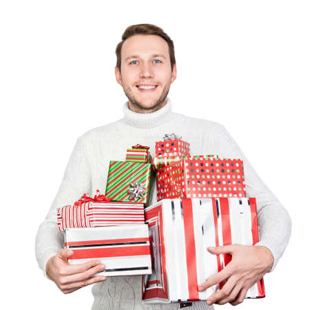 Young man with gifts isolated on whiteの写真素材