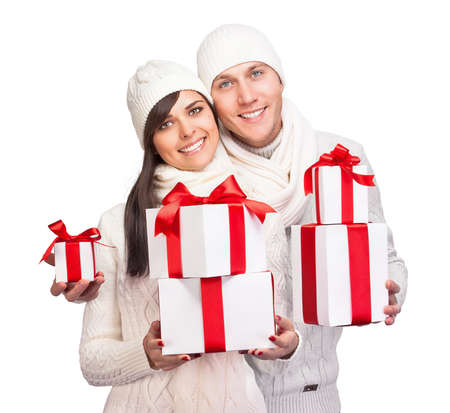 Young couple with Christmas gifts isolated on white backgroundの写真素材