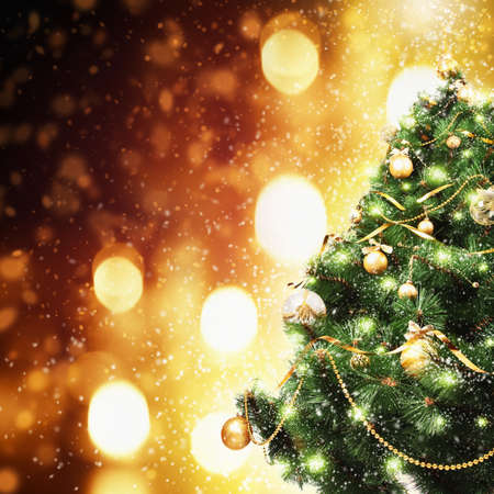 Christmas tree with balls and snow on bright backgroundの写真素材