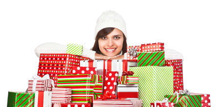Beautiful girl with Christmas gifts isolated on white backgroundの写真素材