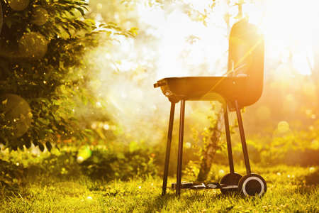 Barbecue grill in sunlight in the gardenの写真素材