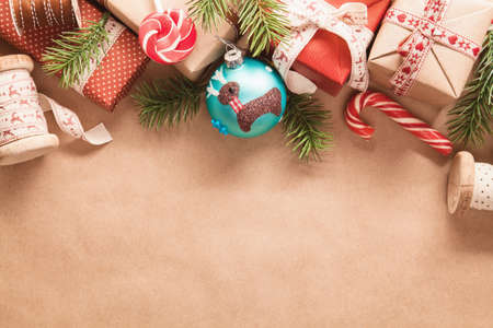 Christmas gifts and decorations on light paper backgroundの写真素材