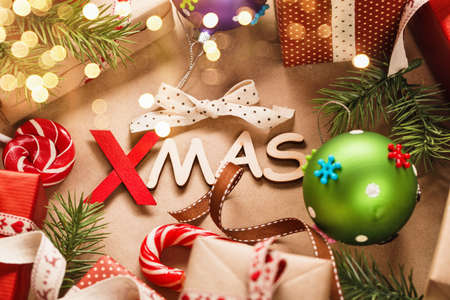 Christmas decorations Xmas with ribbons and toys on paper backgroundの写真素材