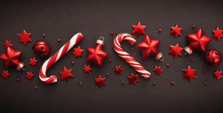 Christmas candy and decorations on dark backgroundの写真素材